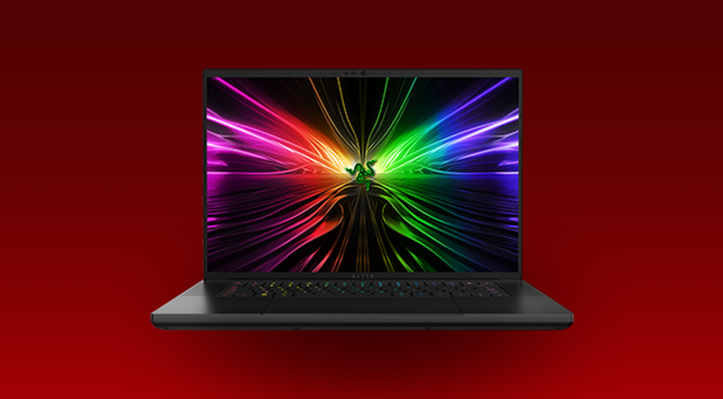 Razer Blade 16 laptop on a desk, highlighting its slim design and portable form factor.