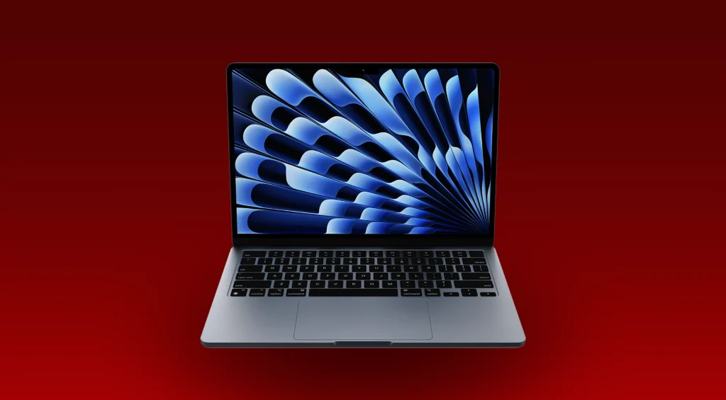 MacBook Air M3 front view on a desk, showcasing its slim profile and compact design.